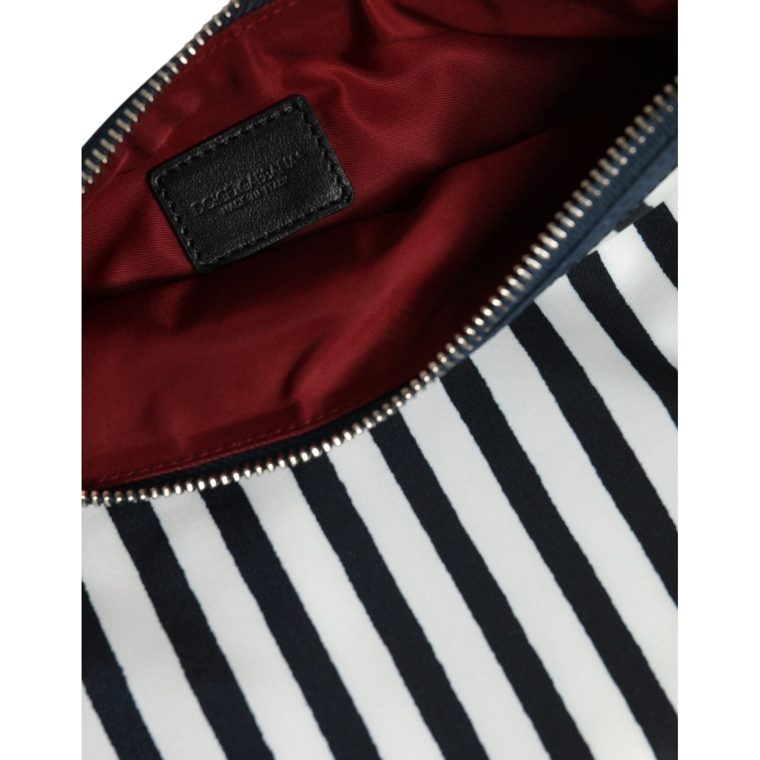 Front view with bag zipped and handles upright.