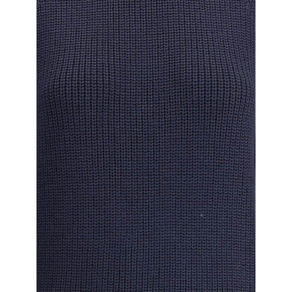 Close-up of the chunky knit fabric of Ella Blue Merino Wool Sweater, showcasing its texture and deep blue color.