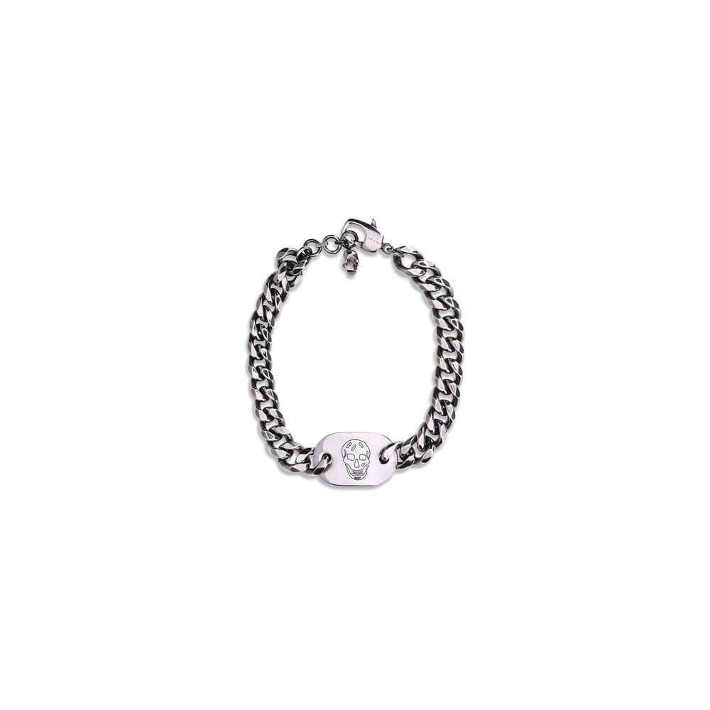Alexander McQueen Silver Brass Bracelet featuring skull charm and engraved logo with antiqued silver chain for bold fashion statement.