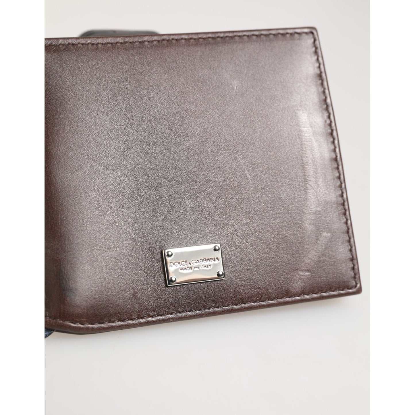 Dolce & Gabbana Brown Leather DG Logo Engrave Bifold Card Holder Wallet on display.
