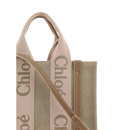 Chloé Beige Linen Handbag with leather details and adjustable strap, showcasing elegance and versatility. Ideal for stylish accessorizing.