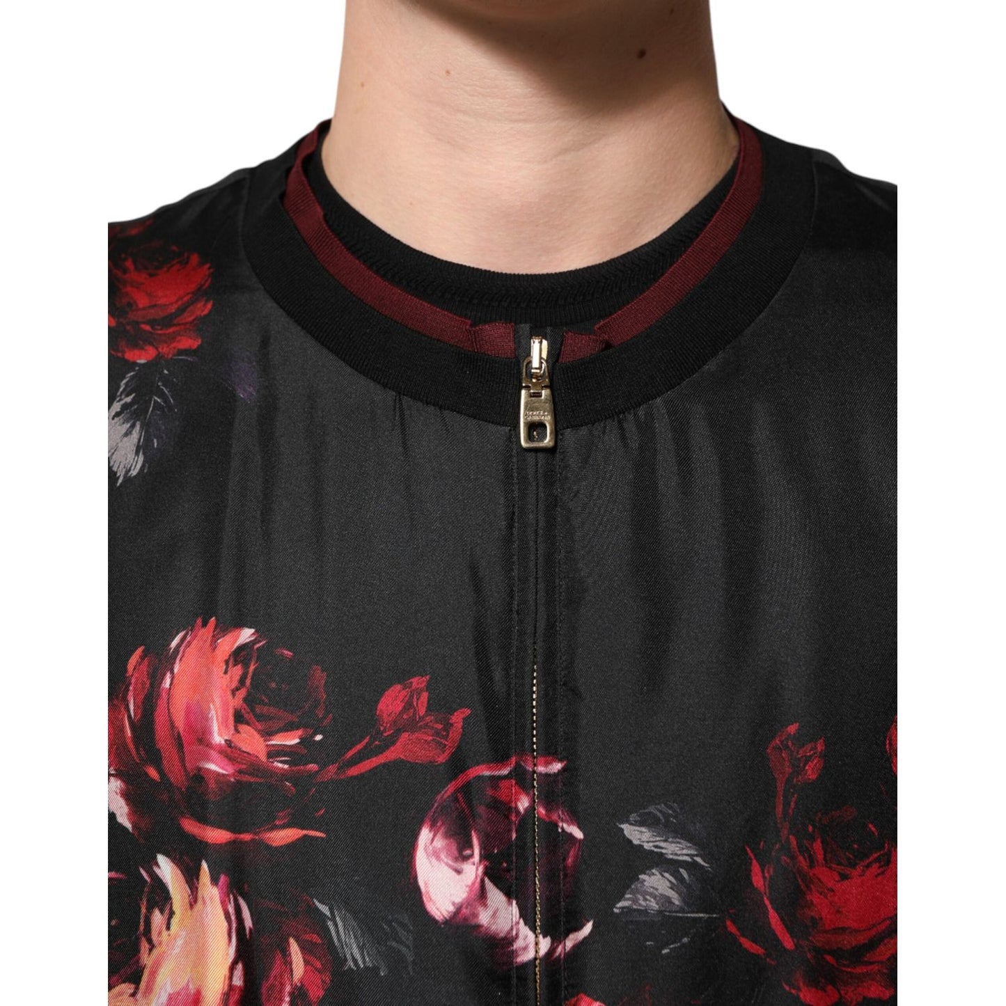 Close-up of Dolce & Gabbana Black Red Floral Silk Bomber Blouson Jacket with zip and burgundy ribbed collar