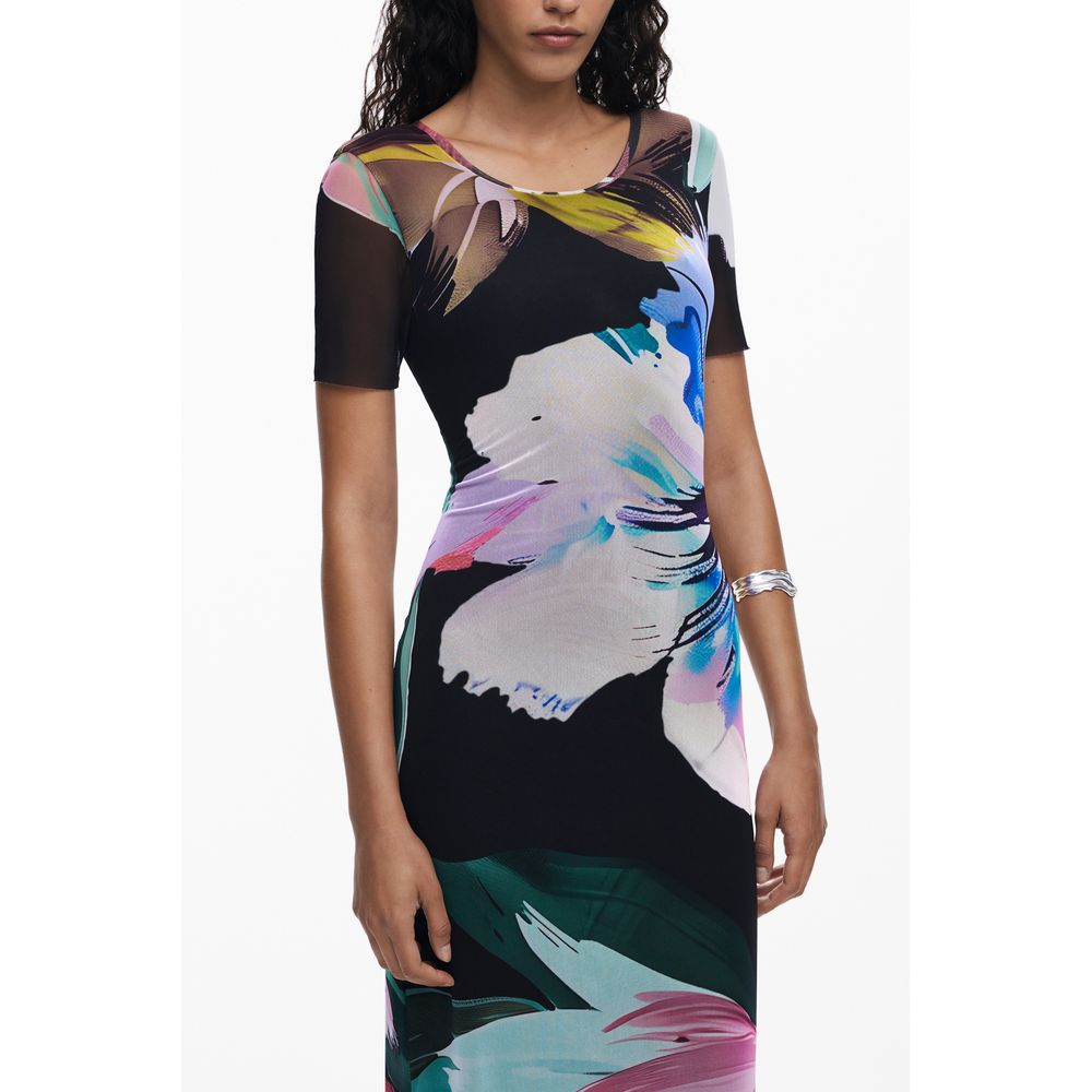 Woman wearing Desigual Black Polyester Women Dress with floral patterns and short sleeves.