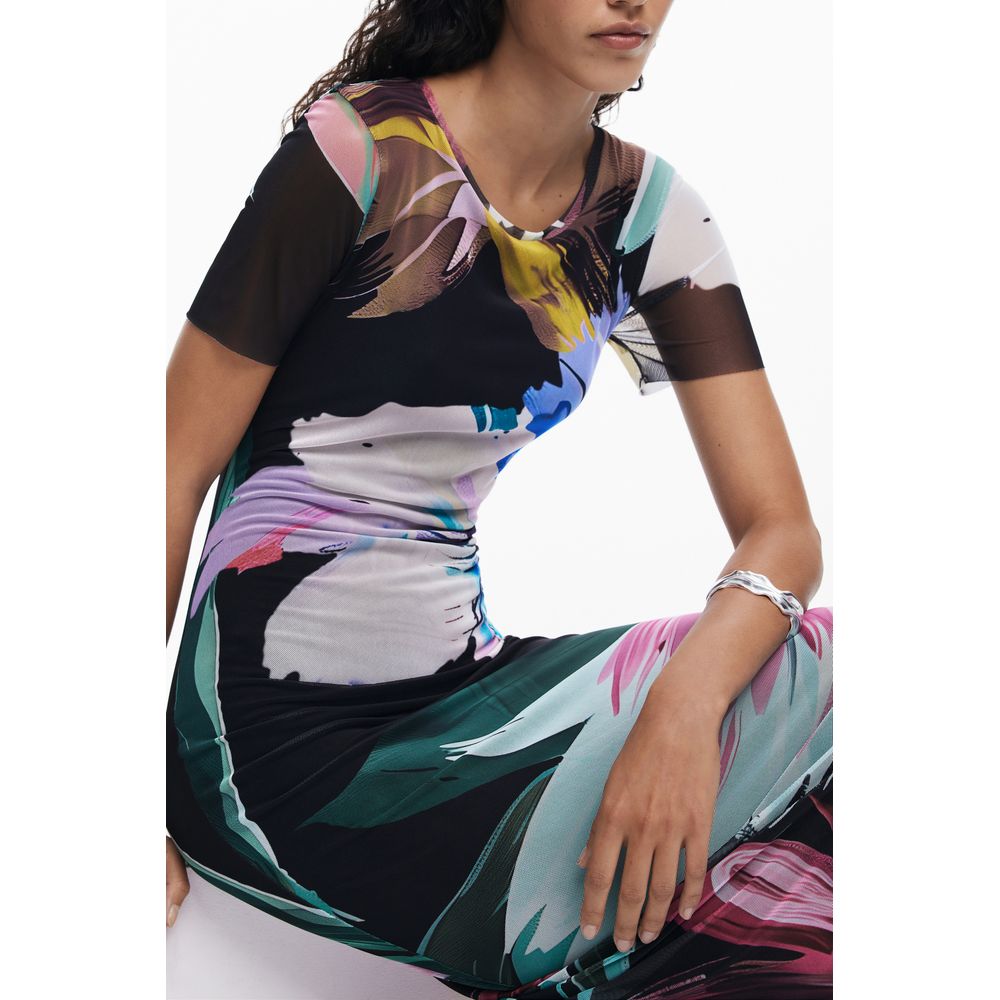 Model wearing Desigual Black Polyester Women Dress featuring colorful patterns with short sleeves, showcasing bold and playful style.