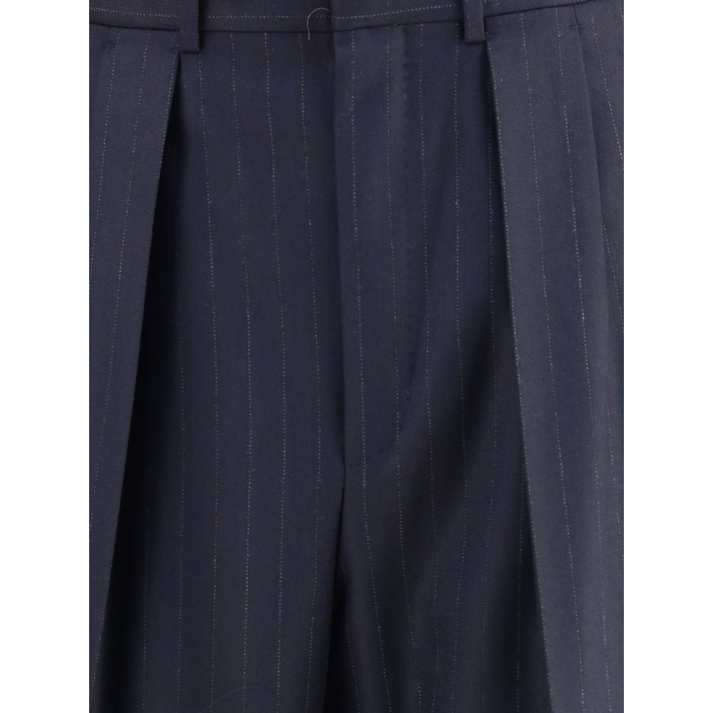 Close-up of Tom Ford Blue Wool Dress Pants with pinstripe design, featuring front pleats, perfect for a formal and sophisticated look.