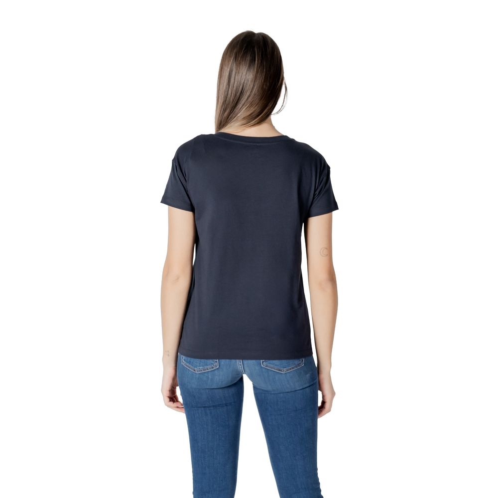 Back view of Armani Exchange Blue Cotton T-Shirt modeled by woman, featuring short sleeves and casual style.