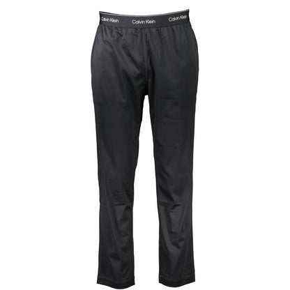 Calvin Klein Black Polyester Pant with elastic waist, lace detail, logo, and two pockets, ideal for sports and casual wear.
