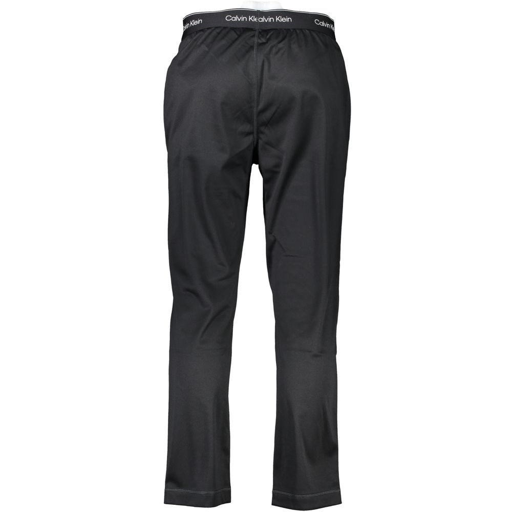 Calvin Klein Black Polyester Pant, sports trousers with elastic waist, lace tie, two pockets, and logo detailing.