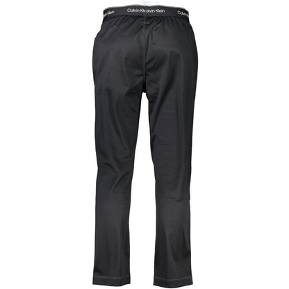 Calvin Klein Black Polyester Pant, sports trousers with elastic waist, lace tie, two pockets, and logo detailing.