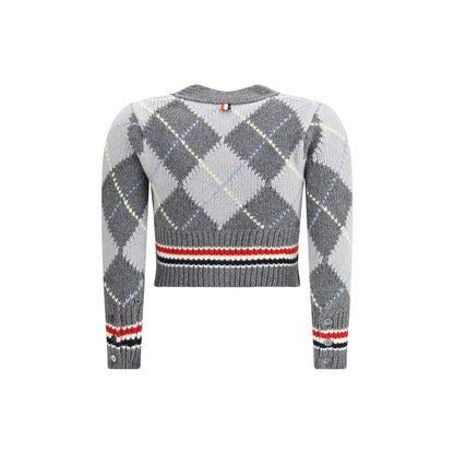 Thom Browne Gray Fleece Wool Cardigan with argyle pattern and cropped length, featuring red and white accents on cuffs and hem.