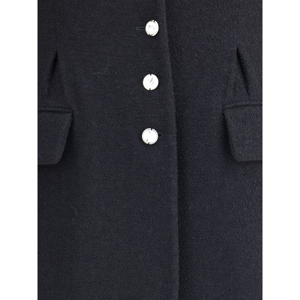 Close-up of Alessandra Rich Black Fleece Wool Coat with jeweled buttons and flap welt pockets, showcasing elegant design.