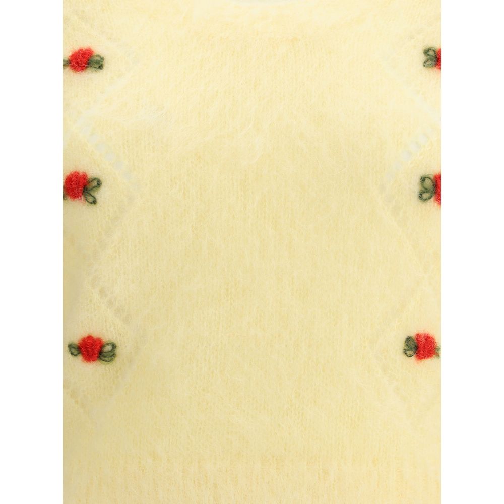 Close-up of Alessandra Rich Yellow Mohair Sweatshirt showing fine openwork details and embroidered flowers, perfect for a feminine look.