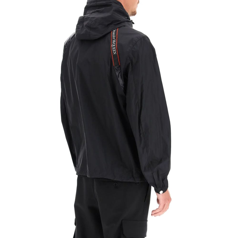 Men's Alexander McQueen Black Polyamide Shell Jacket with long sleeves, elasticated cuffs, front zip, and shoulder selvage belt.