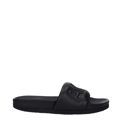 Alt Tag: Ambush Black Leather Slippers with open toe design and rubber sole, featuring front logo, style street, MPN BMIC001LEA0011000.
