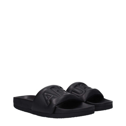Alt Tag: Ambush Black Leather Slippers with front logo, open toe design, and rubber sole, model MPN BMIC001LEA0011000, street style.