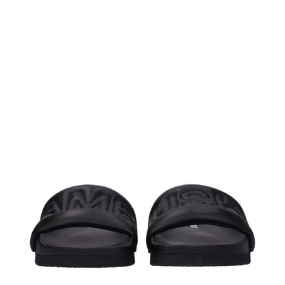 Ambush Black Leather Slippers with front logo, open toe design, and rubber sole for street style.