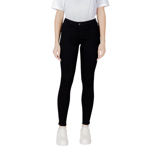 Woman wearing Armani Exchange Black Cotton Skinny Jeans showcasing sleek slim fit, ideal for versatile styling and comfort.