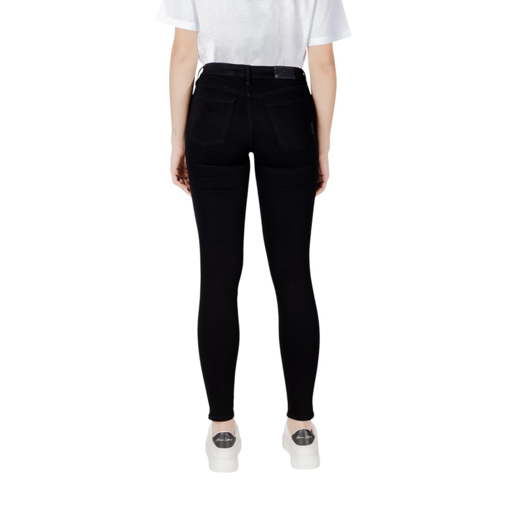 Woman wearing Armani Exchange Black Cotton Skinny Jeans from the back, showing slim design and perfect fit.