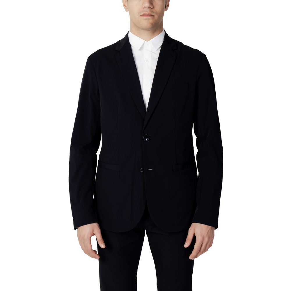 Man wearing Armani Exchange Blue Cotton Blazer with two-button closure and classic lapels, ideal for a sophisticated wardrobe.