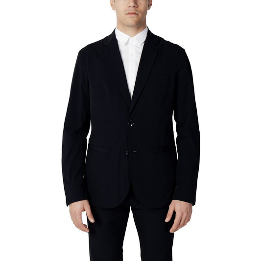 Man wearing Armani Exchange Blue Cotton Blazer with two-button closure and classic lapels, ideal for a sophisticated wardrobe.