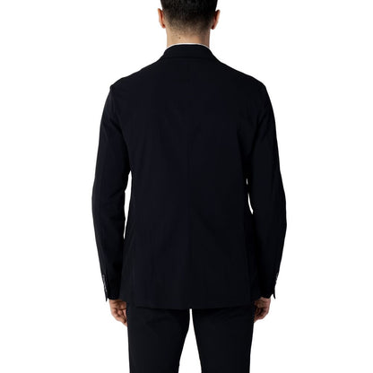 Back view of Armani Exchange Blue Cotton Blazer worn by a model, showcasing its sleek design and comfortable fit.