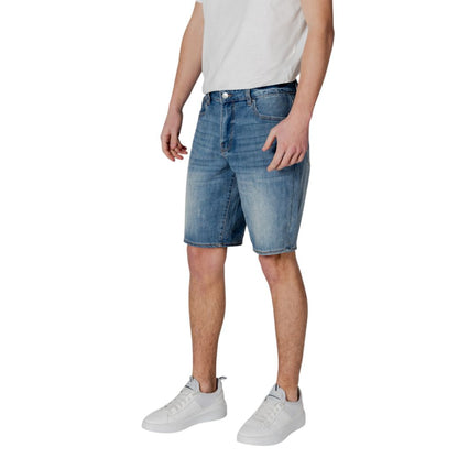 Man wearing Armani Exchange Blue Polyester Bermuda Shorts with white sneakers and a casual white t-shirt.