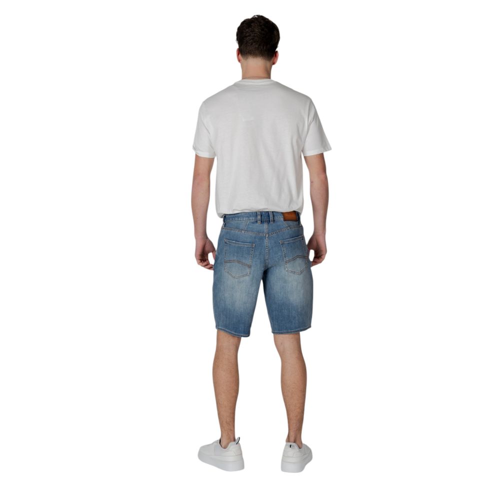 Back view of a man wearing Armani Exchange Blue Polyester Bermuda Shorts with a white t-shirt and sneakers.