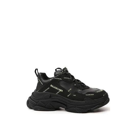 Alt Tag: Balenciaga Triple S Sneakers in black with logo detailing, featuring a round toe and lace-up closure, made of calf leather.