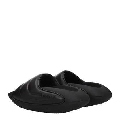 Balmain Black Leather Slippers with side logo and open toe design, featuring mid heels and rubber sole. Stylish casual footwear.