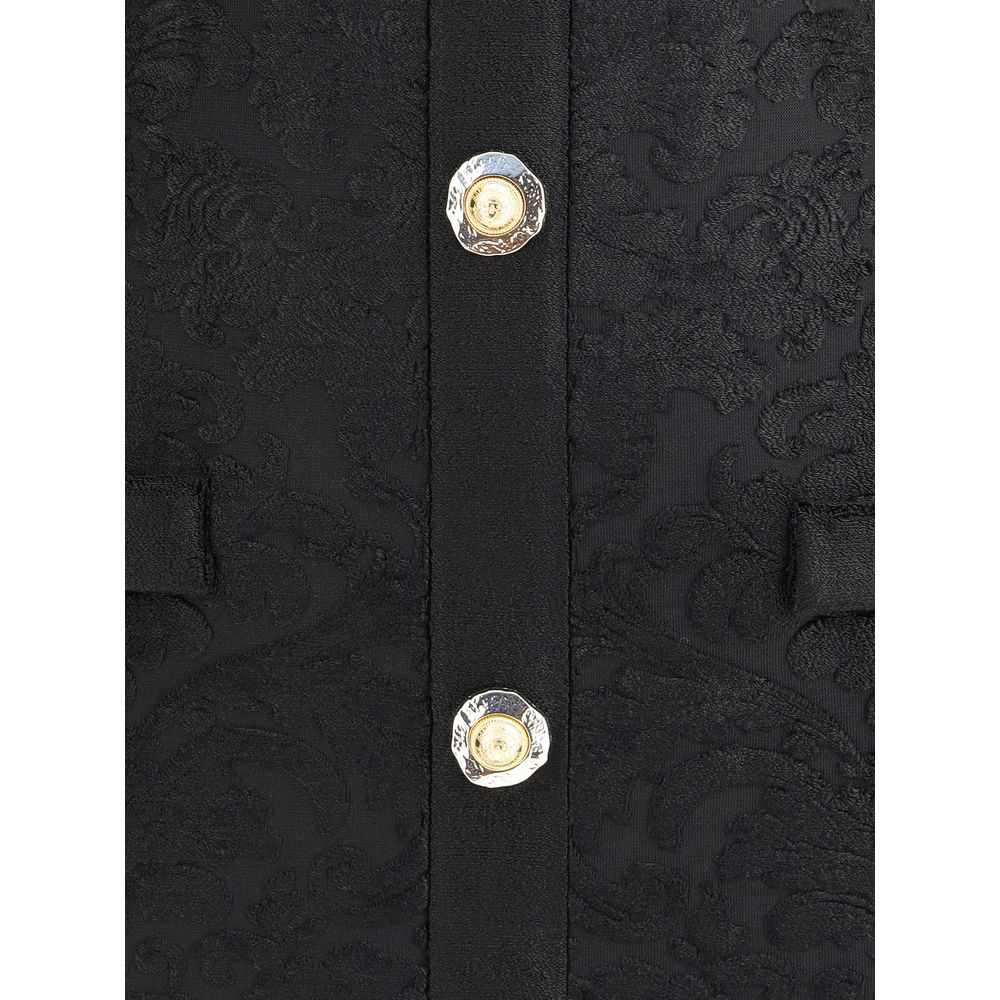 Detailed view of gold embossed buttons on Balmain Black Viscose Cocktail Dress with baroque pattern.