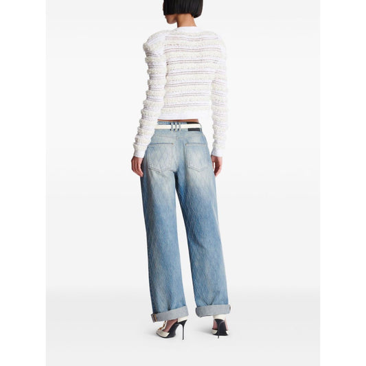 Back view of model wearing Balmain Long-sleeved tweed-effect knit cardigan with pinched shoulders and ribbed trim, size 36 FR.