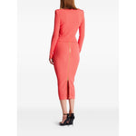 Back view of a woman wearing a coral pink Balmain Long-sleeved twisted knit cardigan with epaulettes and gold zipper detailing.