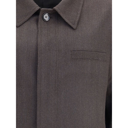 Brioni Brown Wool Coat with herringbone pattern, featuring a classic collar and welt breast pocket. Elegant and sophisticated design.