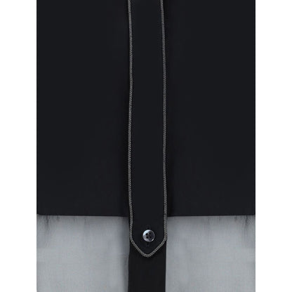 Close-up of Brunello Cucinelli Black Cotton Pattern Shirt with button detail and semi-transparent design.