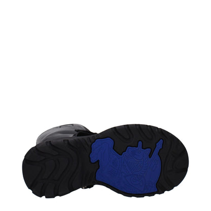 Sole view of Burberry Black Leather Boots with a vibrant blue design, round toe, rubber sole, and mid heel. MPN: 8096904, style: casual.