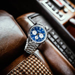 CASIO EDIFICE WATCHES Mod. EFR-575D-2AEF, stainless steel chronograph wristwatch with blue dial, on car seat