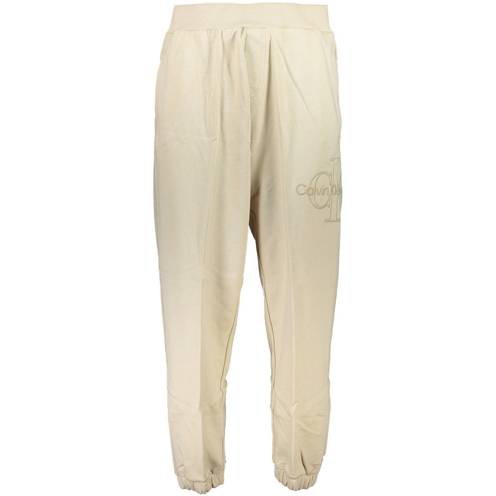 Calvin Klein Beige Cotton Pant featuring elastic waist and ankles, 3 pockets, with logo embroidery. Made from 50% transitional cotton.