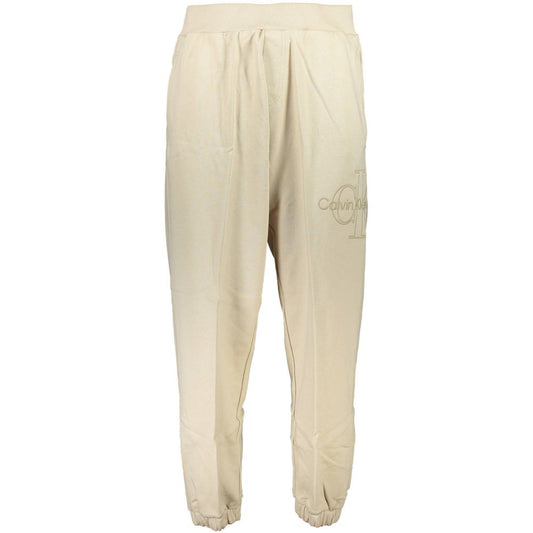 Calvin Klein Beige Cotton Pant featuring elastic waist and ankles, 3 pockets, with logo embroidery. Made from 50% transitional cotton.