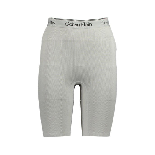 Calvin Klein Gray Polyester Pant featuring short gym shorts with elastic waistband, contrasting details, and logo print.