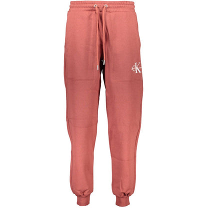 Calvin Klein Red Cotton Pant with elastic waist, fleece lining, ankle cuffs, sports embroidery, and logo on front.