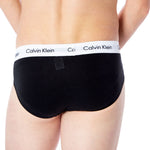 Man wearing Calvin Klein Underwear Black Cotton Underwear with logo waistband, showcasing comfort and fit. Ideal for daily wear.