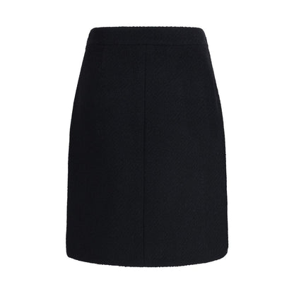 Chloé Black Wool Midi Skirt with front flap pockets and gold-tone buttons, crafted from premium bouclé wool for AW25 collection.