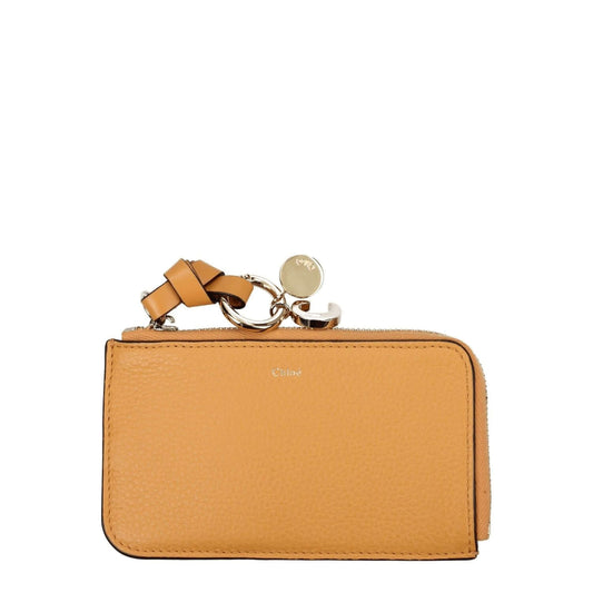 Chloé Orange Leather Wallet with gold accents and zip closure, featuring a front logo design, ideal for casual style coin purse.