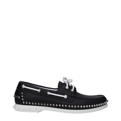 Christian Louboutin Black Leather Slip-On Loafers with studs, lace-up closure, rubber sole, and round toe in side view.