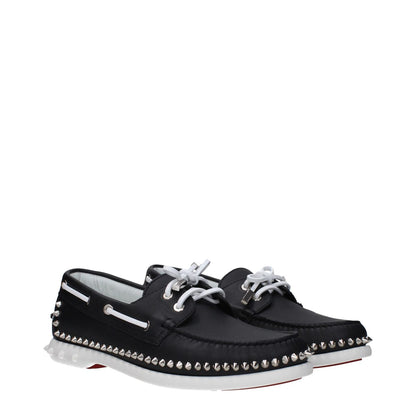 Christian Louboutin Black Leather Slip-On Loafers with studs, lace-up closure, and round toe design featuring rubber sole.