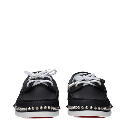 Front view of Christian Louboutin Black Leather Slip-On Loafers with studs, lace-up closure, and rubber sole.