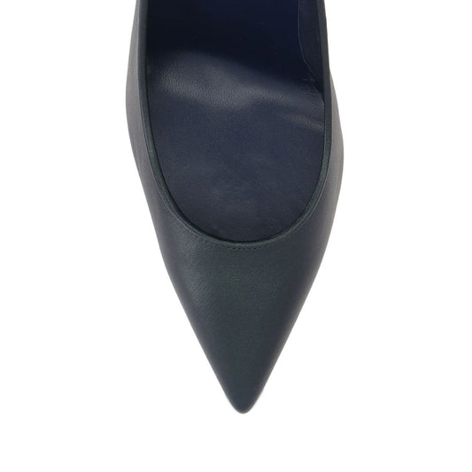 Close-up of Christian Louboutin Kate 100 mm Pumps - Nappa leather in blue lambskin with pointed toe and red sole.
