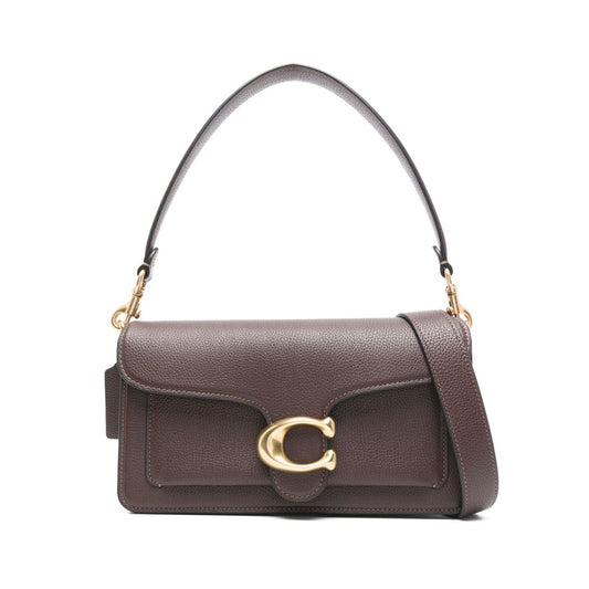 Coach Tabby 26 leather shoulder bag in earth brown with pebbled texture, featuring a gold logo plaque and detachable straps.