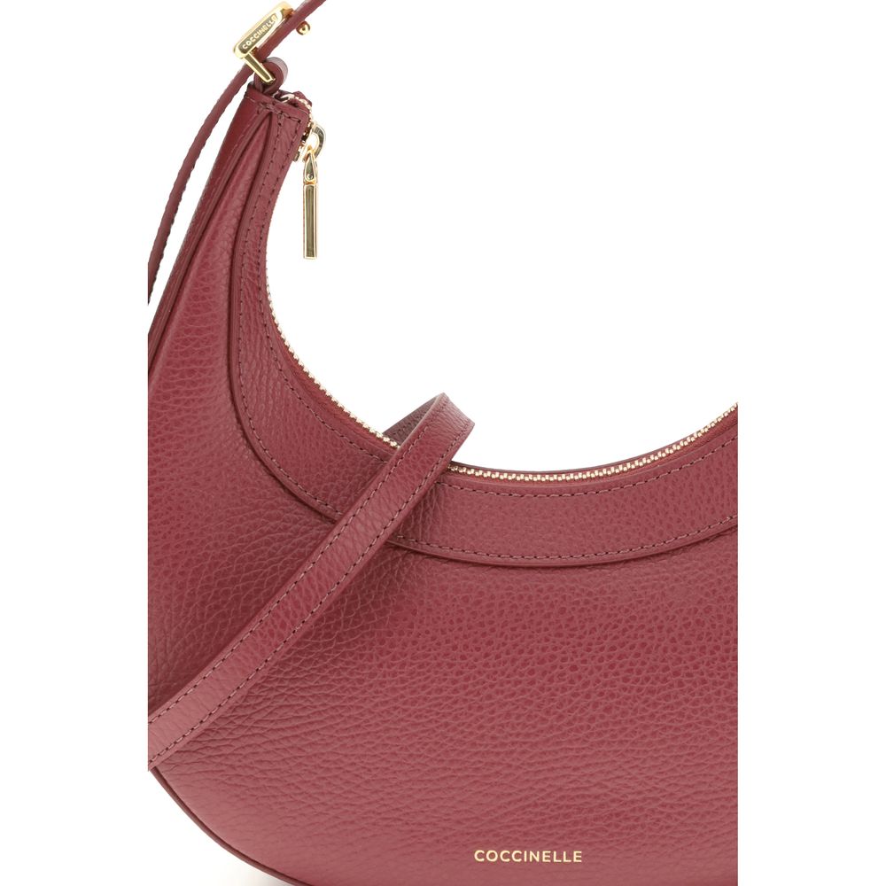 Coccinelle Red Calf Leather Bos Taurus Shoulder Bag with adjustable strap and zippered closure, stylish and versatile design