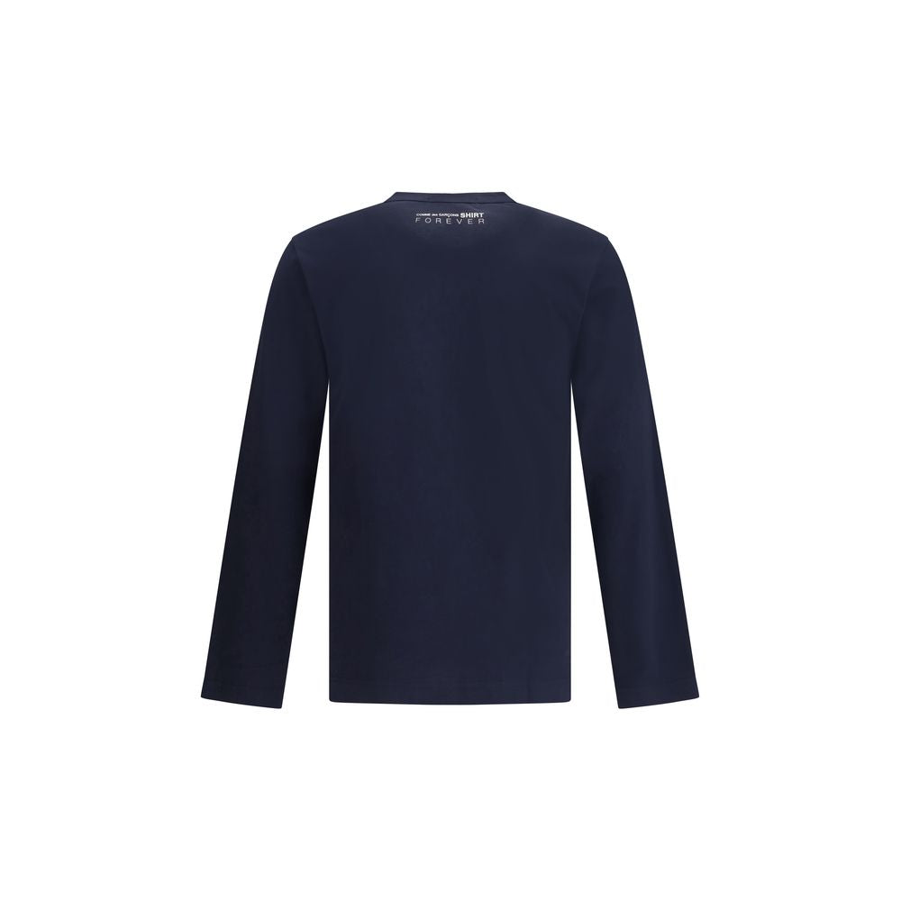 Back view of Comme Des Garçons Blue Cotton Long Sleeve T-Shirt with printed logo, showcasing crew neck and long sleeves, ideal for AW25.